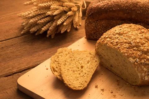 Breads on chopping board Stock Photos