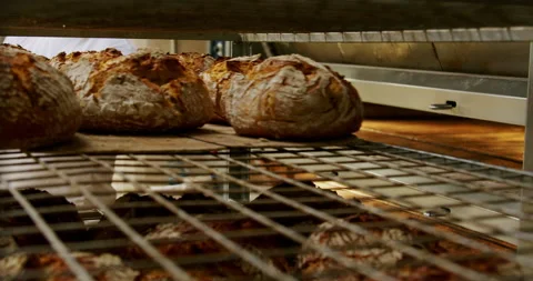 Breads fresh out of the oven at a bakery 4K. Stock-Footage 221567229