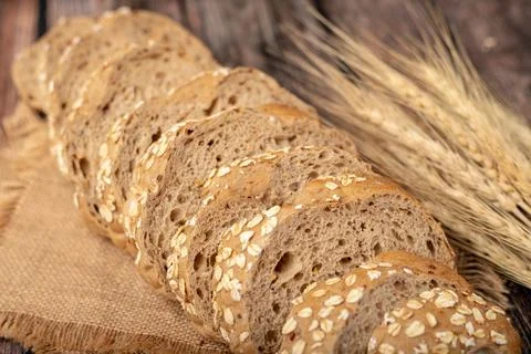 Breads sliced and wheatgrass on the sack Stock Photos