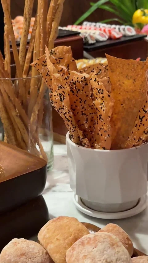 Breadsticks buffet baskets somebody is taking a croissant out of a breadbasket Stock Footage 316230037