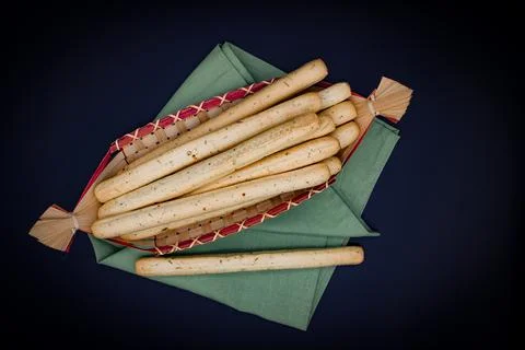 Breadsticks on dark background Stock Photos