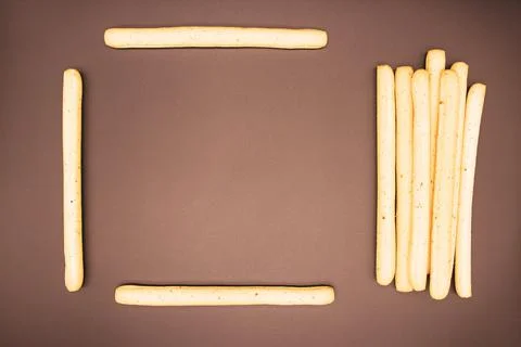 Breadsticks on dark background Stock Photos
