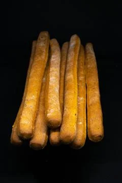 Breadsticks isolated on a black background Stock Photos