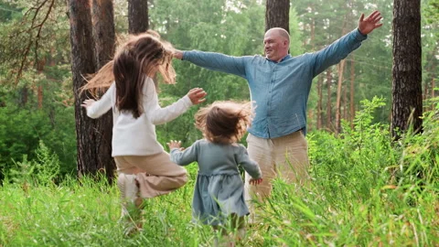 Breadwinner Spreading Hands Waiting For Daughters Hug In Green Forest Stock Footage 326039067