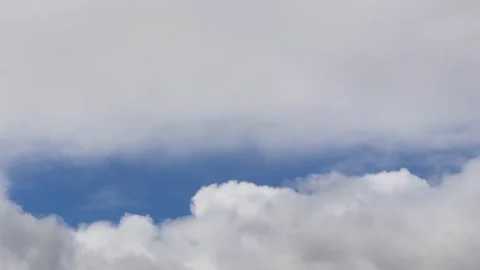 Break of blue in fluffy clouds Stock Footage 133911453