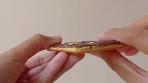 Break the chocolate cookie into two pieces Stock Footage 151025937