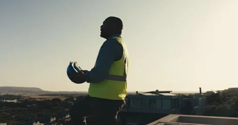 Break, construction and thinking with black man on building site for end of day Stock Footage 344372348