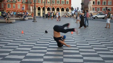 Break dancer does headspin in city square slowmotion clip 1 Stock Footage 45910549