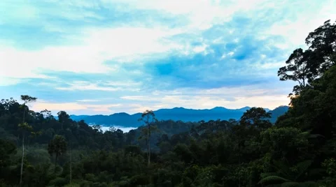 Break of dawn time-lapse with moving clouds at a tropical highland jungle Stock Footage 56758841