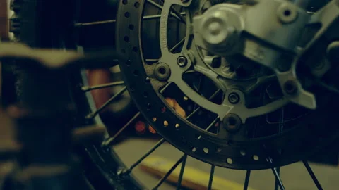 Break disc and spokes on a wheel indoors Stock Footage 279008312