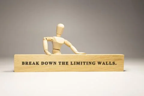 Break down the limiting walls written on wooden surface. Motivation and perso Stock Photos