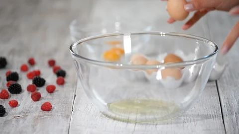 Break egg. Cooking food. Baking ingredients, breaking the eggs, separating yolk Stock-Footage 109057922