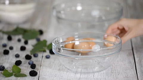 Break egg. Cooking food. Baking ingredients, breaking the eggs, separating yolk Stock-Footage 120088478