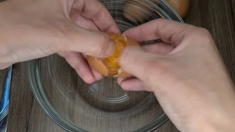Break Eggs Into A Bowl Stock-Footage 165542776