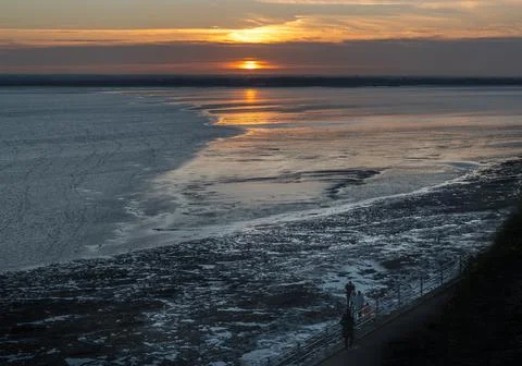 A break in heavy clouds allows for a beautiful sunset in Ramsgate, Kent, UK. Stock Photos