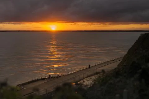 A break in heavy clouds allows for a beautiful sunset in Ramsgate, Kent, UK. Stock-Fotos