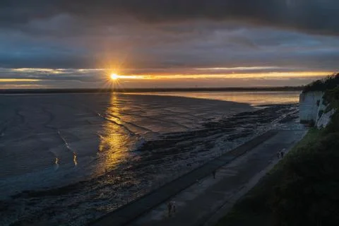 A break in heavy clouds allows for a beautiful sunset in Ramsgate, Kent, UK. Stock Photos