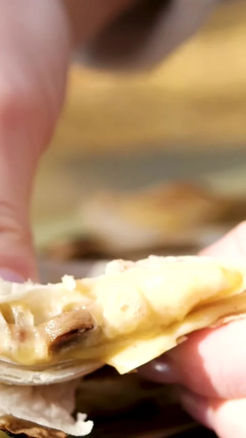Break up lavash with cheese. Hands stretching while breaking lavash bread. Close Stock Footage 327912573