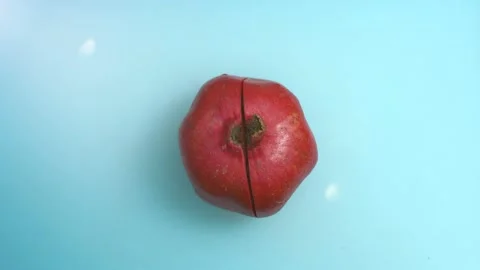 Break the pomegranate in half Stock Footage 134470868