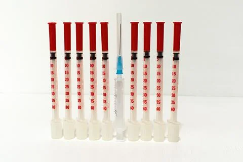 Break the rhythm by one difference between 9 the same syringes Stock Photos