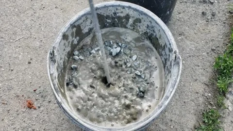 Break of solution in a bucket Stock Footage 311029874