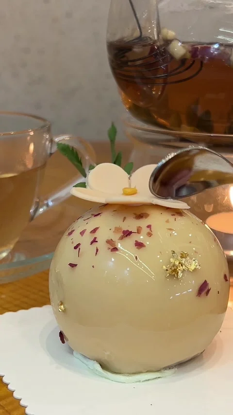 Break spoon chocolate dessert white chocolate layer near candle tea cheesecake Stock Footage 317698357
