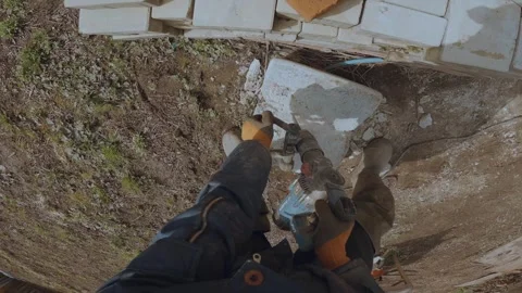 Break a stone with a jackhammer Stock Footage 333412899