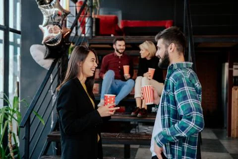 Break time in a modern office center charismatic and multiethnic workers Foto stock