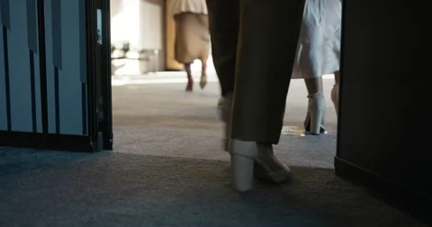 Break, walking and legs at seminar with exit, networking and interval at trade Stock Footage 323319542