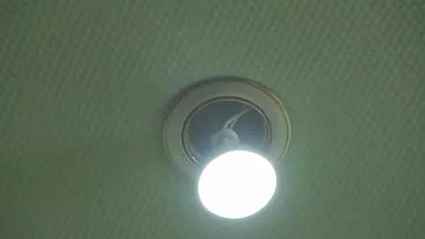Breakage of a ceiling lamp that falls out of its place. Poor-quality instal.. Video stock 249158759