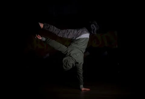 Breakdance dancer in a pose on one hand Stock Photos
