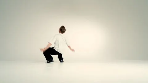 Breakdance freeze pose in bright studio Stock Footage 345601704