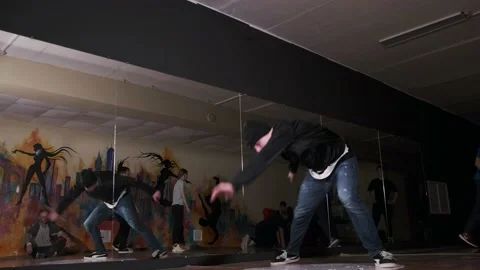 Breakdancer dancing hip hop, break dance. Dancing school. Slow motion Stock Footage 131878720