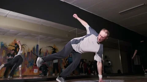 Breakdancer dancing hiphop, break dance. Dancing school. Slow motion Stock Footage 131878768