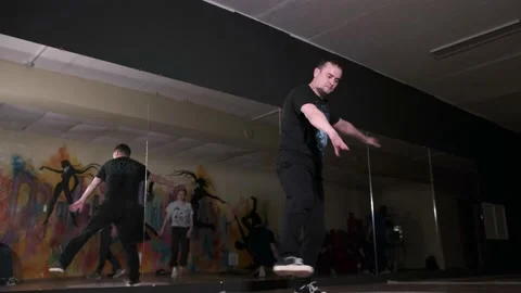 Breakdancer dancing hiphop, break dance. Dancing school. Slow motion Stock Footage 131878820