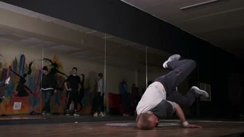 Breakdancer dancing hiphop, break dance. Dancing school. Slow motion Stock Footage 131878864