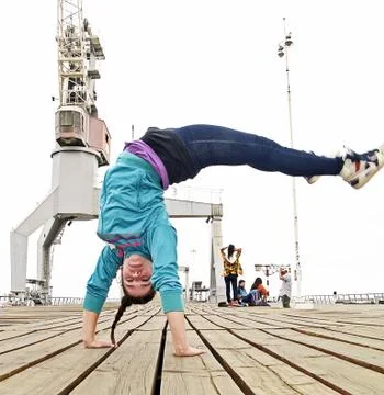 Breakdancer handstanding and jumping Stock Photos
