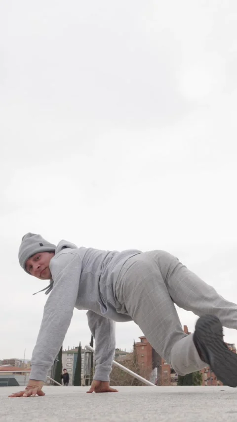 Breakdancer performing a choreography in urban environment Stock Footage 305911093