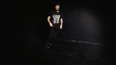 Breakdancer performing the elements dance on wood floor Stock-Footage 82546576