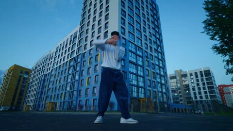 Breakdancer Performing Freestyle Dance On City Street In Summer Evening, Full Stock Footage 248894458