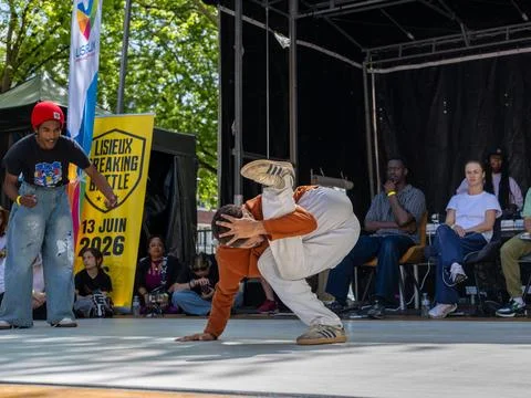 Breakdancer performing a one-hand freeze Stock Photos