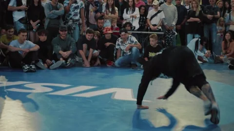 Breakdancing. Professional male dancer performing show. B-boy doing some stunts. Stock Footage 162062010