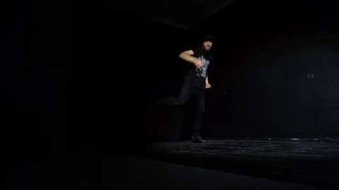 Breakdancing step and movements dancer performer is doing on the ground Stock Footage 82585189
