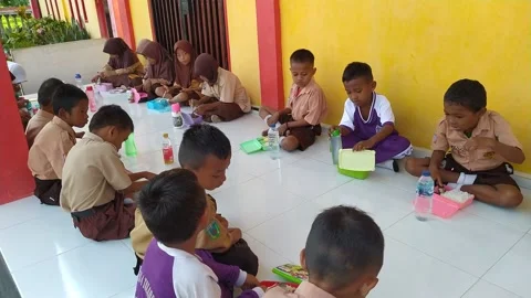 Breakfast activities with friends at school. Central Sulawesi/indonesia/01062024 Stock Footage 260574651