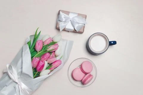 Breakfast and bouquet on table. flat lay composition with flowers and a cup o Stock Photos