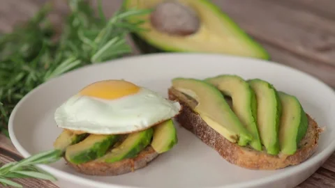 Breakfast avocado eggs toast Stock Footage 302291362