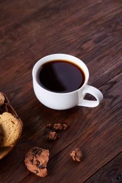 Breakfast background with mug of fresh coffee, homemade oatmeal cookies, grind Stock Photos