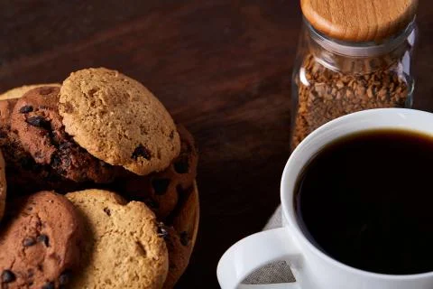Breakfast background with mug of fresh coffee, homemade oatmeal cookies, grind Stock Photos