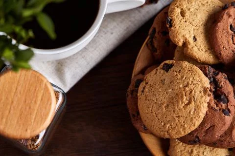 Breakfast background with mug of fresh coffee, homemade oatmeal cookies, grind Stock Photos