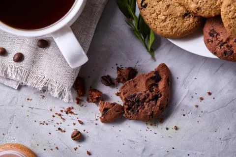 Breakfast background with mug of fresh coffee, homemade oatmeal cookies, grind Stock Photos